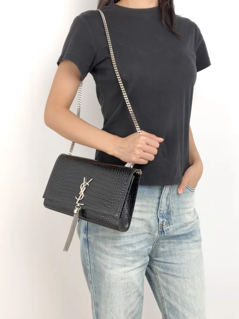 SAINT LAURENT Crossbody Bag KATE Edition Black Calfskin Medium 24 × 5.5 × 14.5 cm — on-model view 1 of 3