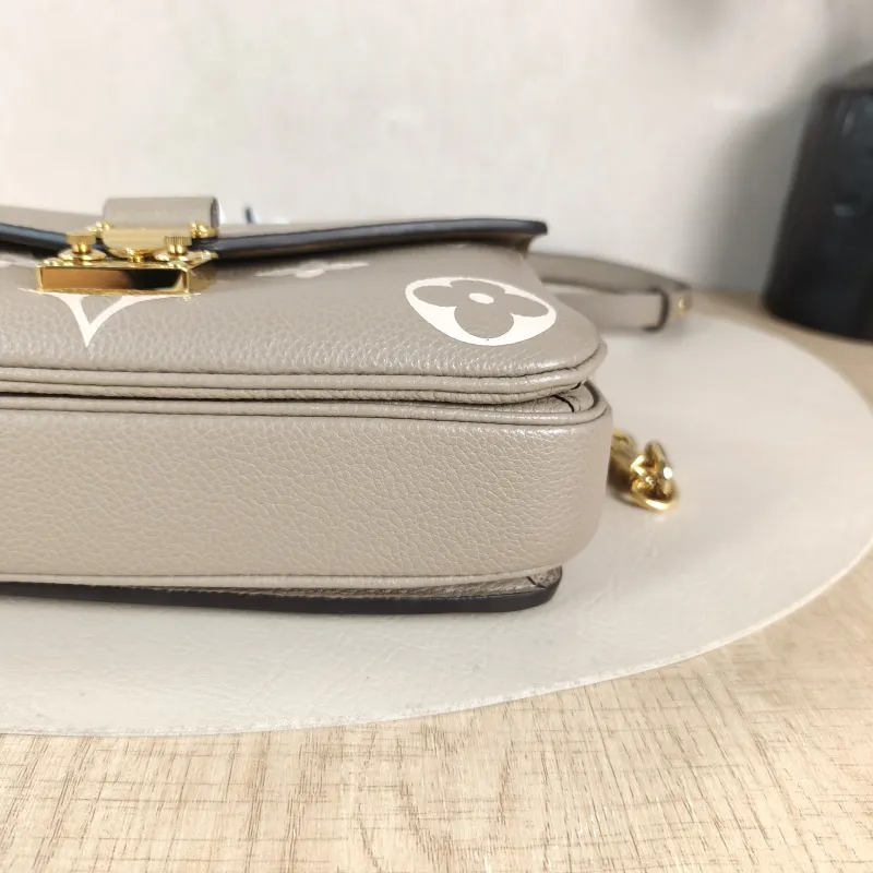 Louis Vuitton Crossbody Bag Pochette Métis East West Monogram Empreinte Embossed Calfskin Small 21.5 × 6 × 13.5 cm — detail view 12 of 12