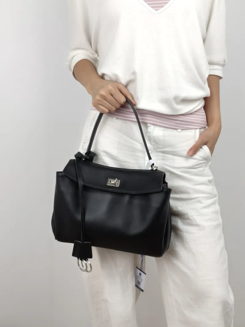 BALENCIAGA Crossbody Bag RODEO Black Calfskin Small 27 × 10 × 20 cm — on-model view 2 of 3