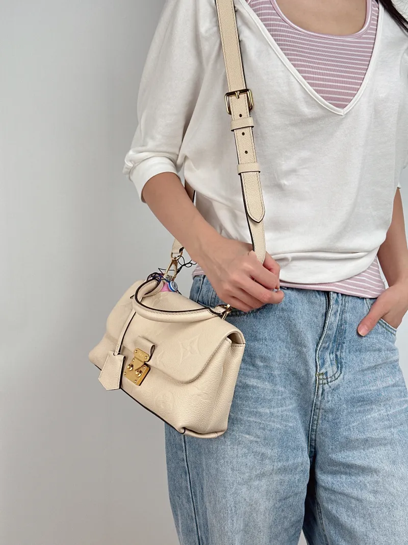 Louis Vuitton Crossbody Bag MADELEINE White Monogram Empreinte Embossed Calfskin BB 24 × 8.5 × 17 cm — on-model view 1 of 3
