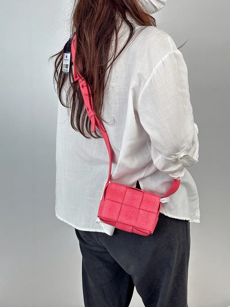 Bottega Veneta Crossbody Bag Cassette Woven Pink PV Cmini15 × 6 × 11 cm — on-model view 1 of 2