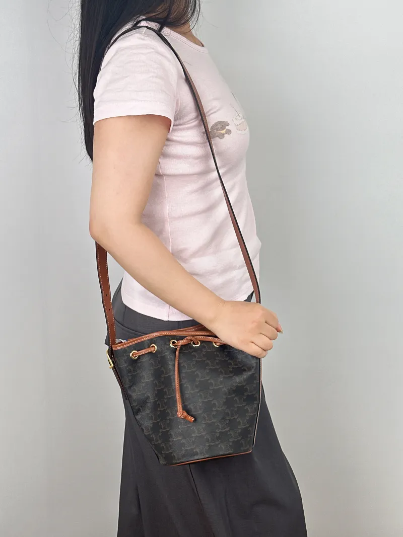 CELINE Crossbody Bag Triomphe Bucket Bag Monogram PVC Small14 × 14 × 21 cm — on-model view 1 of 2