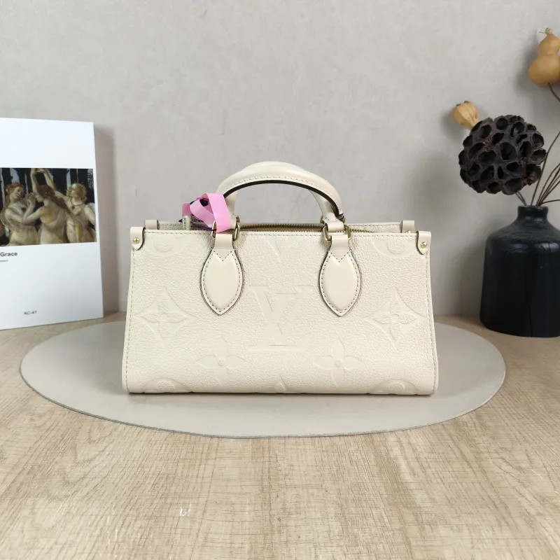 Louis Vuitton Crossbody Bag Onthego East West Two Straps White Empreinte Embossed Calfskin Small 25 × 10 × 13 cm — cover view 3 of 6