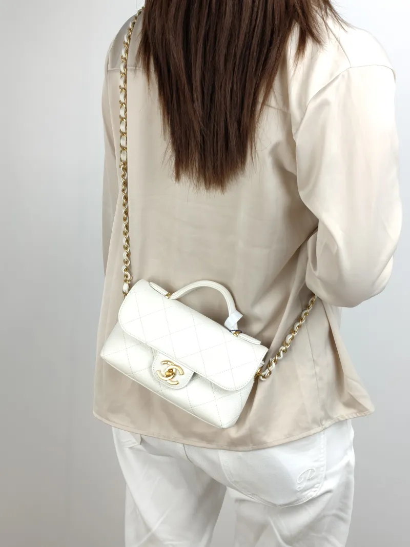 Chanel Crossbody Bag 25k cf Collection Top Handle Bag White Gold Grained Calfskin One Size 20 × 5 × 13 cm — on-model view 1 of 3