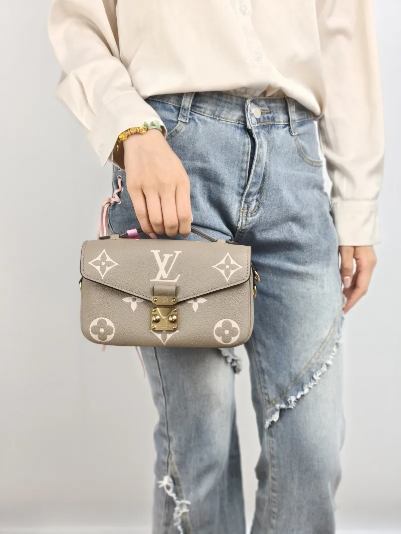 Louis Vuitton Crossbody Bag Pochette Métis East West Monogram Empreinte Embossed Calfskin Small 21.5 × 6 × 13.5 cm — on-model view 2 of 3