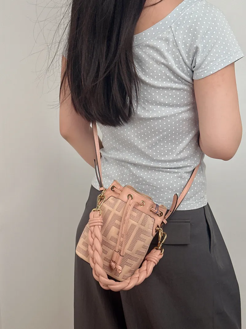FENDI Crossbody Bag Mon Tresor Bucket Bag Pink Canvas Mini 12 × 10 × 18 cm — on-model view 2 of 2