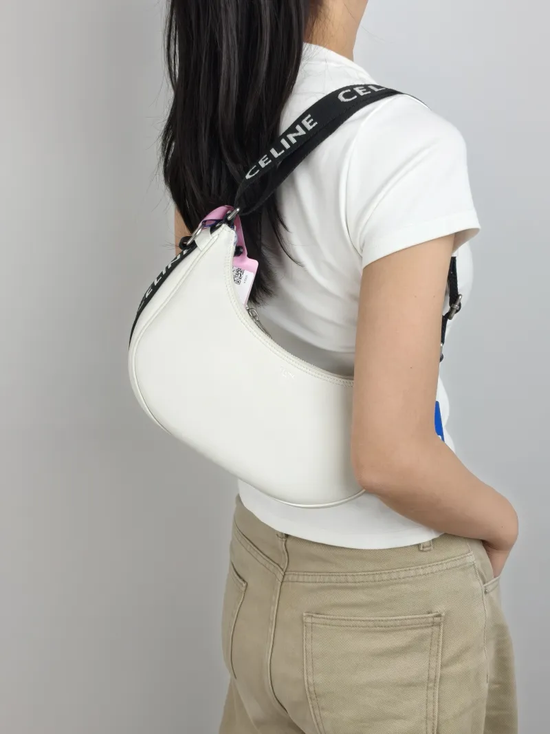 CELINE Shoulder Bag White Calfskin One Size 23 × 7 × 13 cm — on-model view 1 of 2