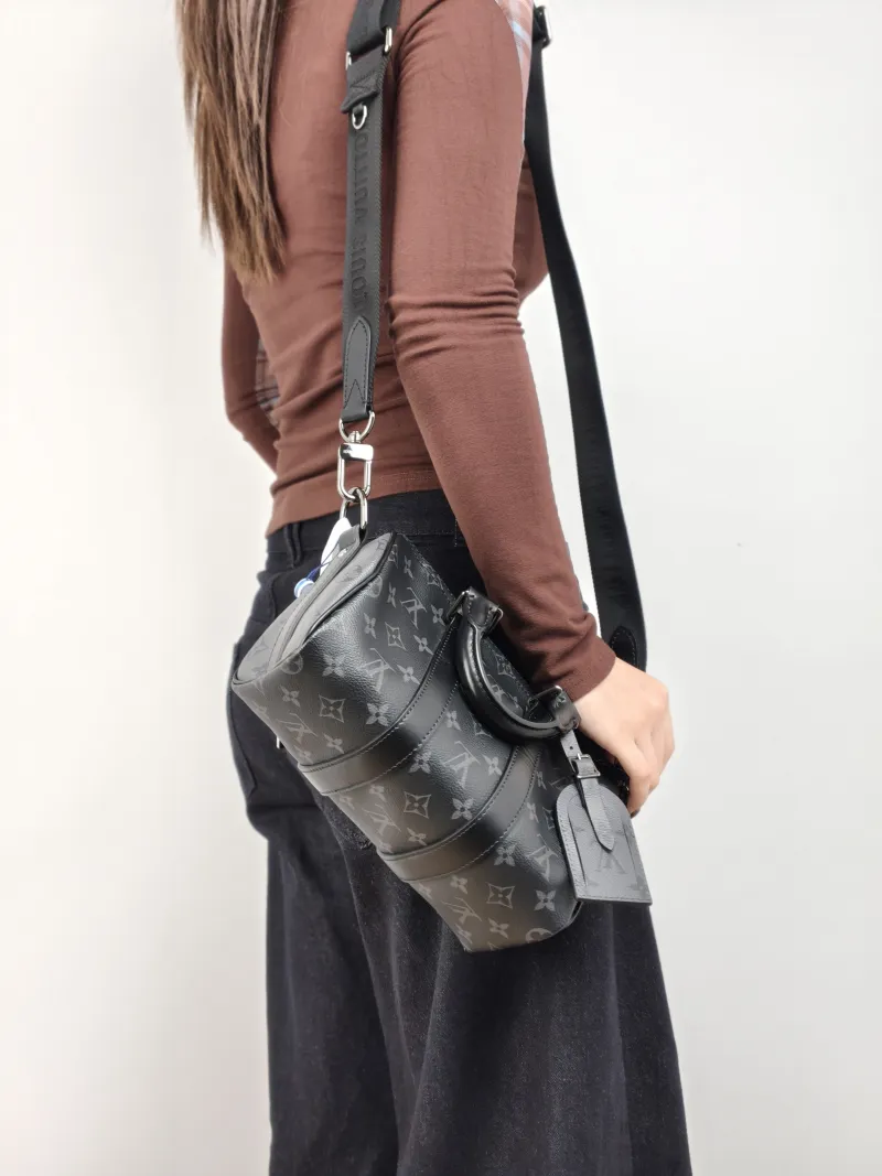 Louis Vuitton Crossbody Bag Keepall 25 PVC Medium 25 × 11 × 15 cm — on-model view 1 of 3