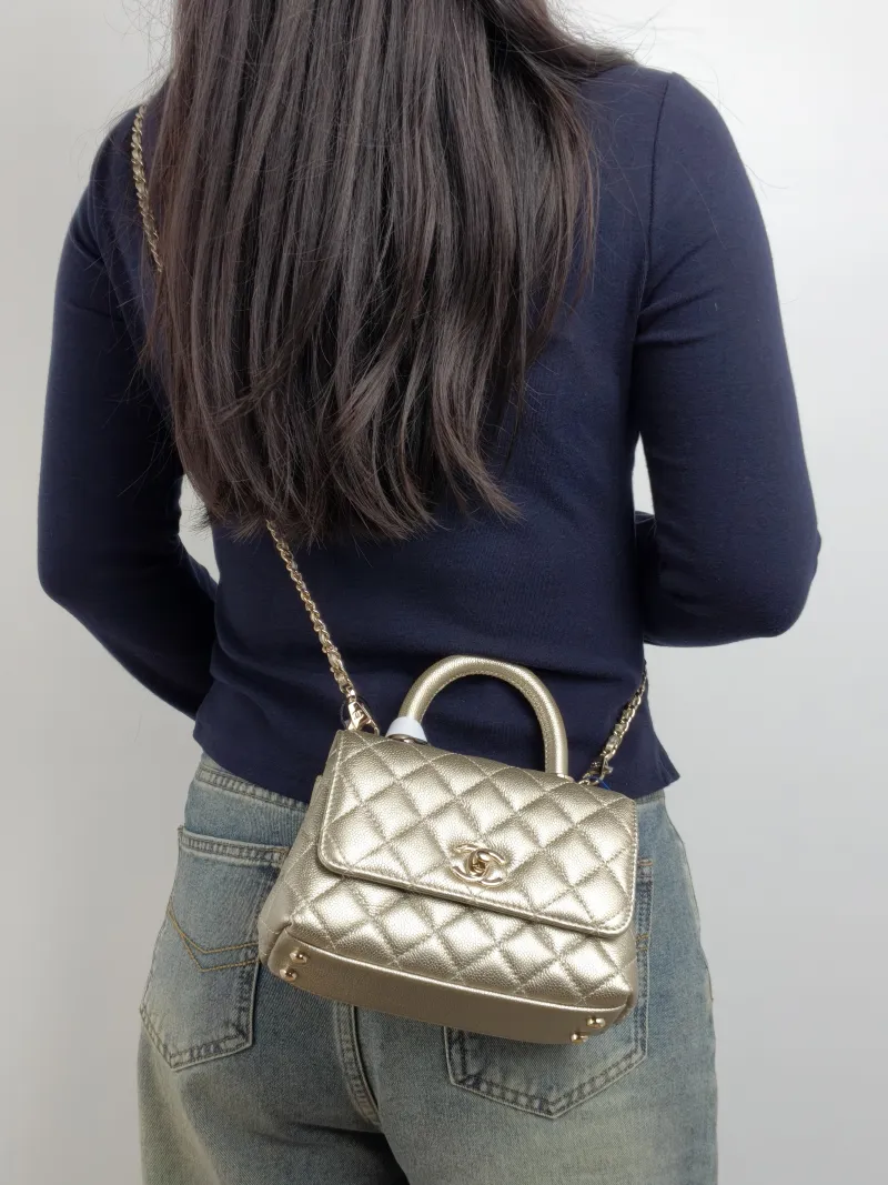 Chanel Crossbody Bag Coco Handle​ Grained Calfskin Mini 19 × 9 × 13 cm — on-model view 1 of 3
