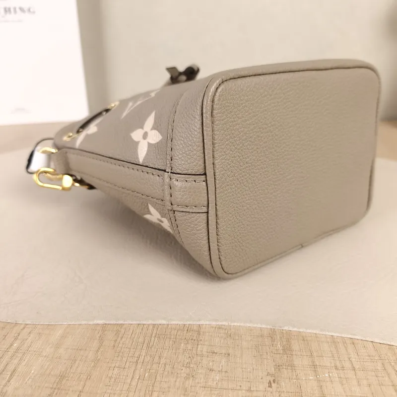 Louis Vuitton Crossbody Bag NANO NOÉ Bucket Bag Nano · White Empreinte Embossed Calfskin Monogramnano13 × 10 × 16 cm — detail view 10 of 11