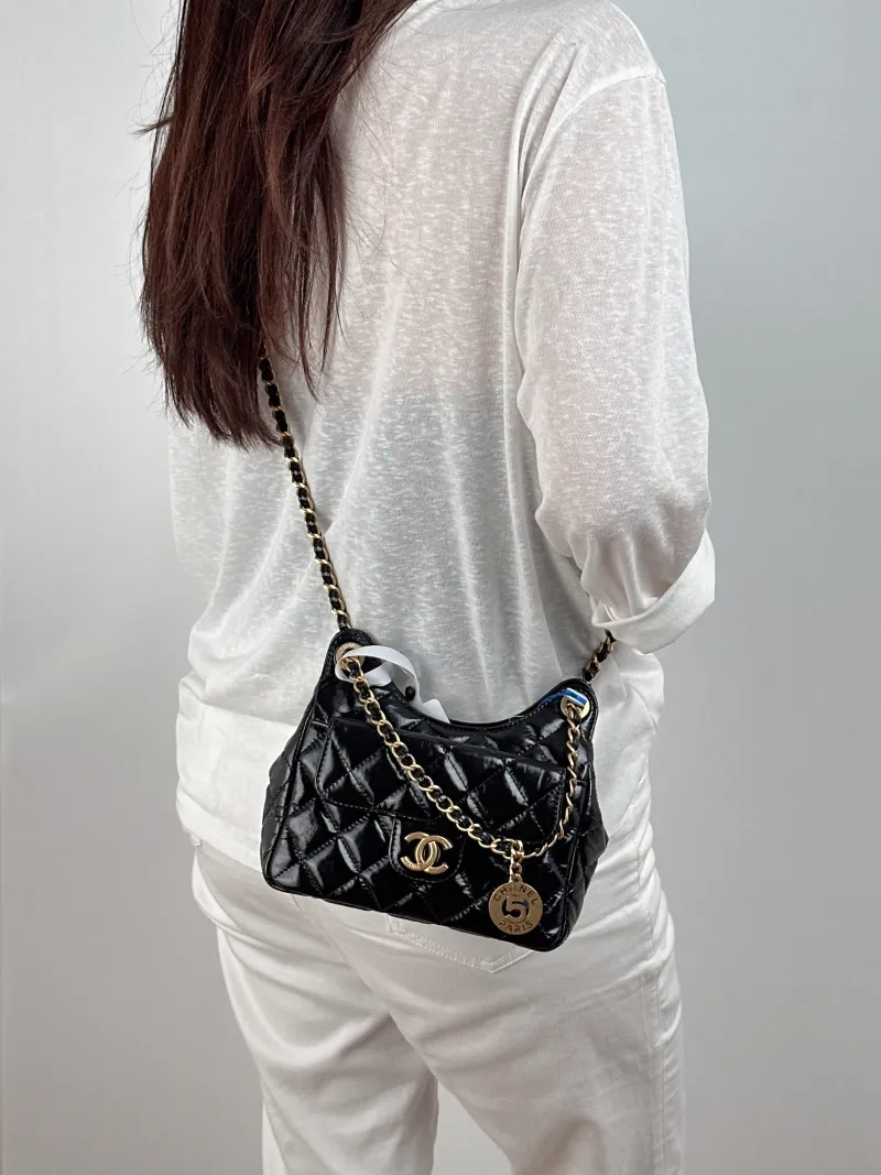 Chanel Crossbody Bag HOBO Black Waxed Leather Calfskin Small 19 × 6 × 17 cm — on-model view 1 of 2