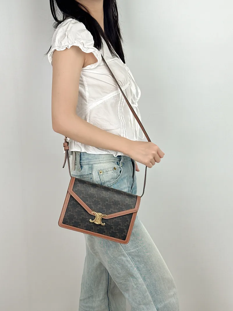 CELINE Crossbody Bag ENVELOPPE TRIOMPHE Monogram PVC Medium 22 × 5 × 15 cm — on-model view 2 of 2