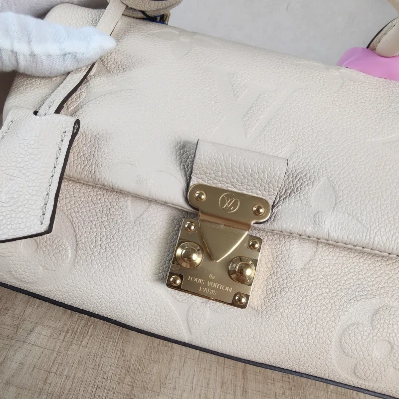 Louis Vuitton Crossbody Bag MADELEINE Beige Monogram Empreinte Embossed Calfskin BB 24 × 8.5 × 17 cm — detail view 1 of 12