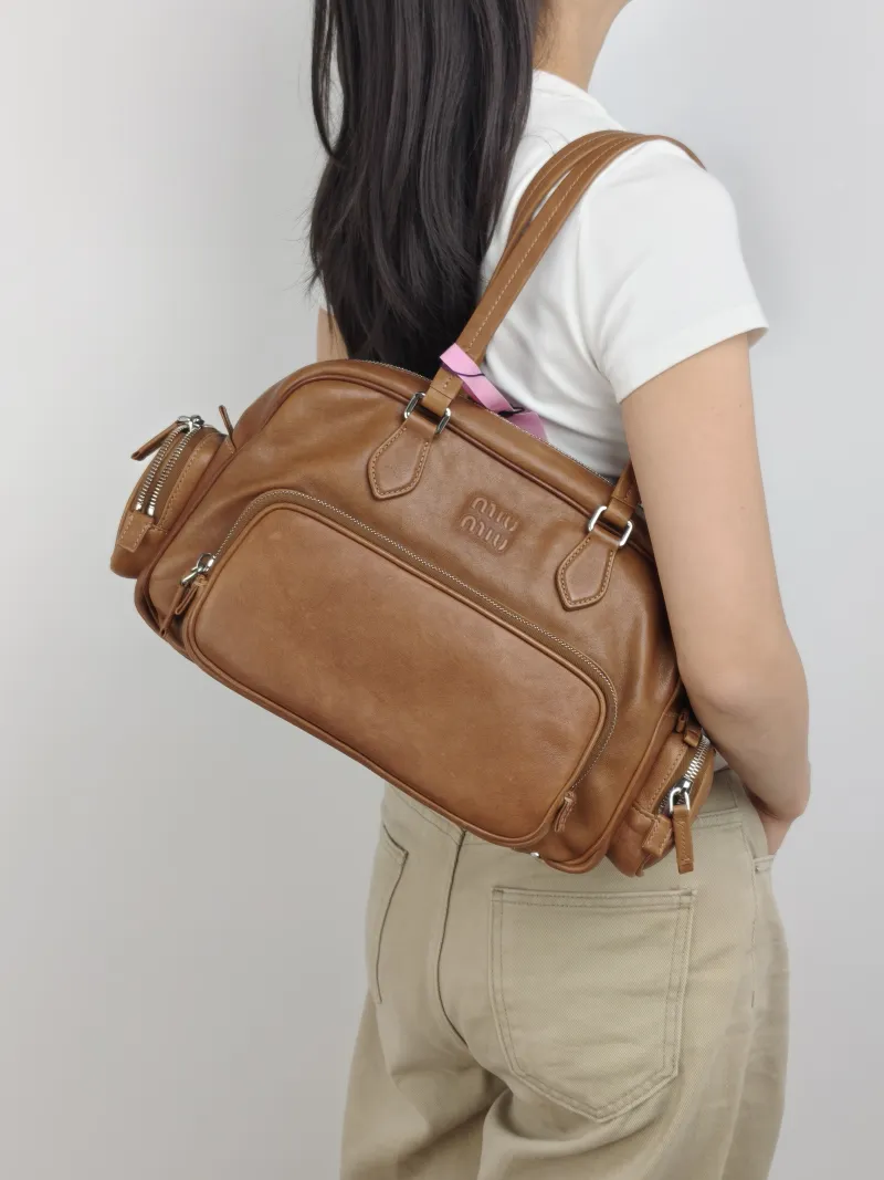 Miumiu Top Handle Bag Pocket Top Handle Bag Caramel SL ambskin One Size 32 × 14 × 22 cm — on-model view 2 of 2