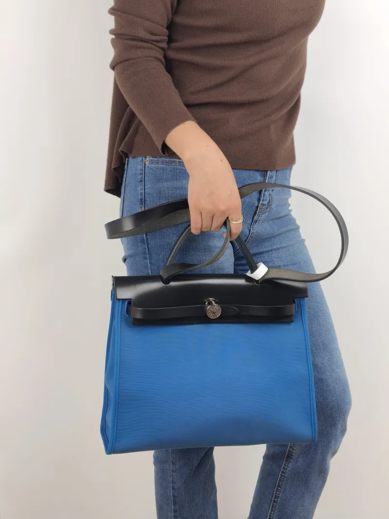 Hermès Crossbody Bag Herbag 31 Blue Black Canvas Medium 30.5 × 11 × 25.5 cm C — on-model view 2 of 2