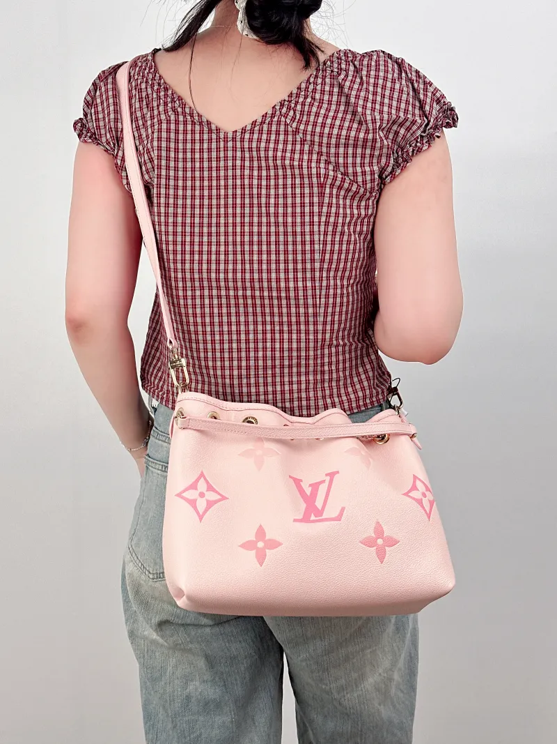 Louis Vuitton Crossbody Bag BUNDLE Pink Monogram Empreinte Embossed Calfskin28 × 11.5 × 20 cm — on-model view 1 of 4
