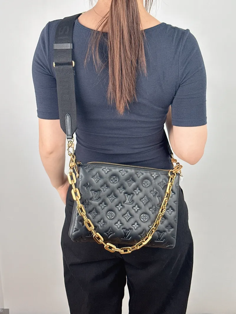 Louis Vuitton Crossbody Bag Coussin Black Lambskin Small 26 × 12 × 20 cm — on-model view 1 of 2