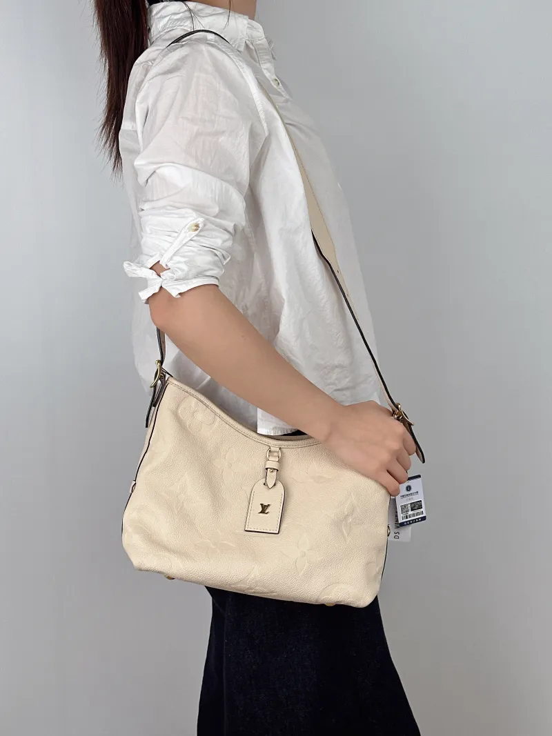 Louis Vuitton Crossbody Bag Carryall White Calfskin Small29.5 × 12 × 24 cm — on-model view 2 of 2