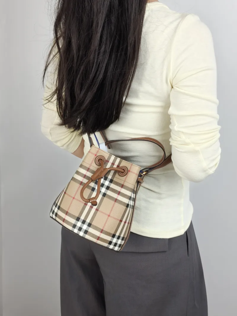 BURBERRY Crossbody Bag Bucket Bag Monogram PVC One Size 17 × 11 × 18 cm — on-model view 1 of 3