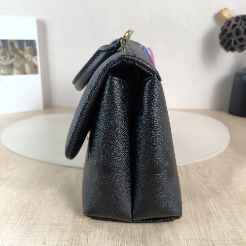 Louis Vuitton Crossbody Bag MADELEINE Black Monogram Empreinte Embossed Calfskin Medium 30 × 11 × 19.5 cm — detail view 7 of 12