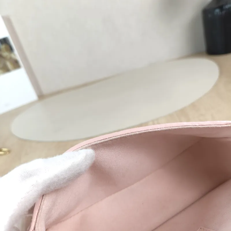 Louis Vuitton Crossbody Bag Diane Baguette Bag Monogram Empreinte Embossed Calfskin nano 19 × 6 × 10.5 cm — detail view 8 of 13