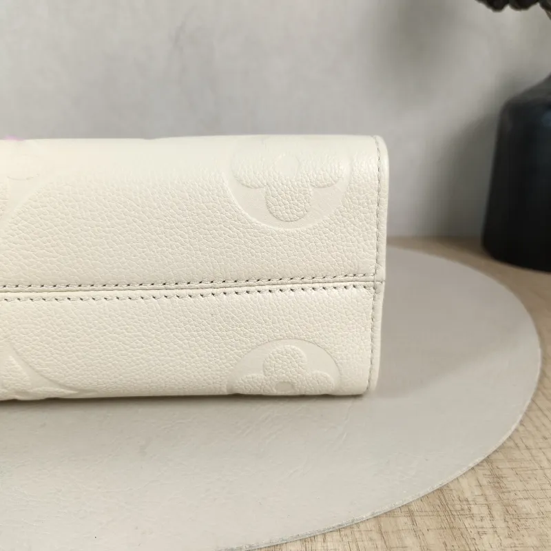 Louis Vuitton Crossbody Bag Onthego East West Two Straps White Empreinte Embossed Calfskin Small 25 × 10 × 13 cm — detail view 13 of 13