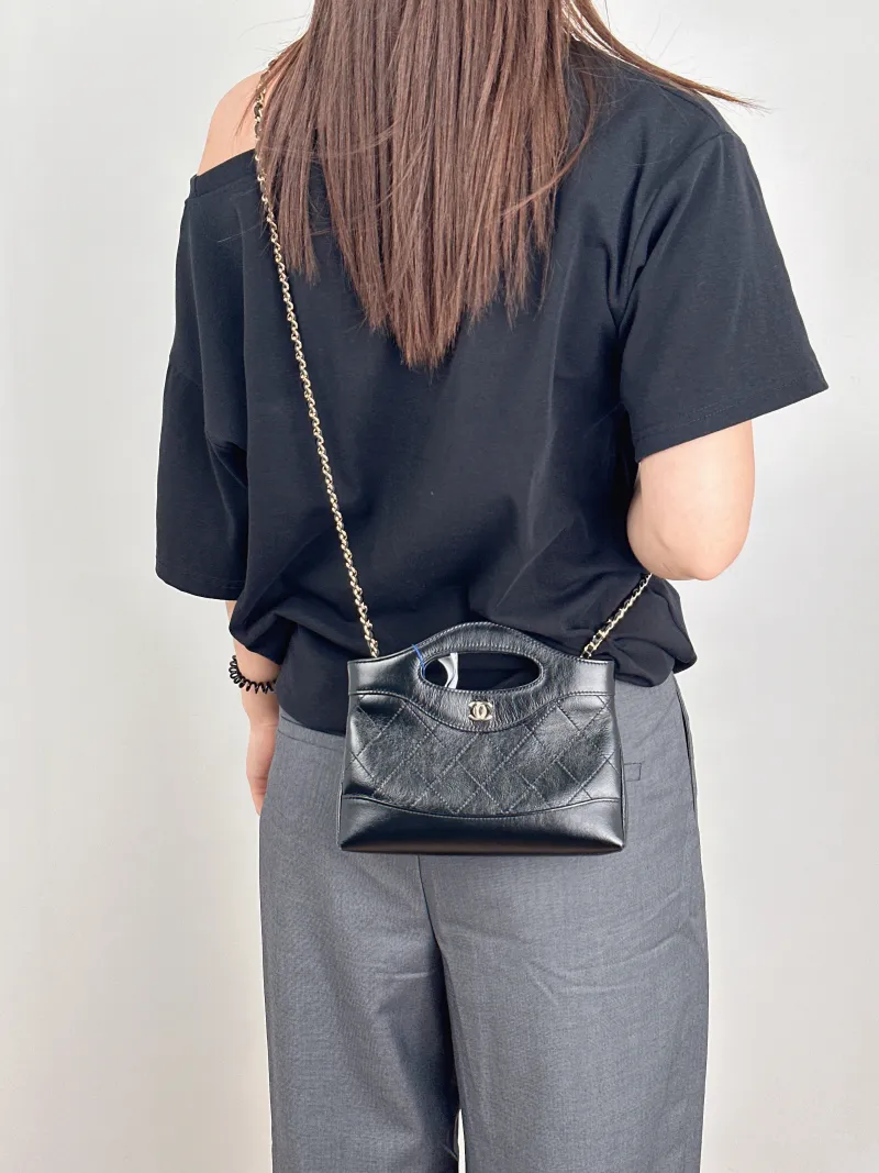 Chanel Shoulder Bag31Bag Black Waxed Leathernano20.5 × 3.5 × 17 cm — on-model view 3 of 3