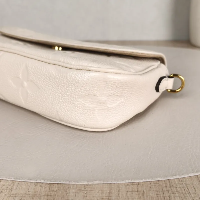 Louis Vuitton Crossbody Bag IVY White Monogram Empreinte Embossed Calfskin Small 23.5 × 4.3 × 12 cm — detail view 1 of 11