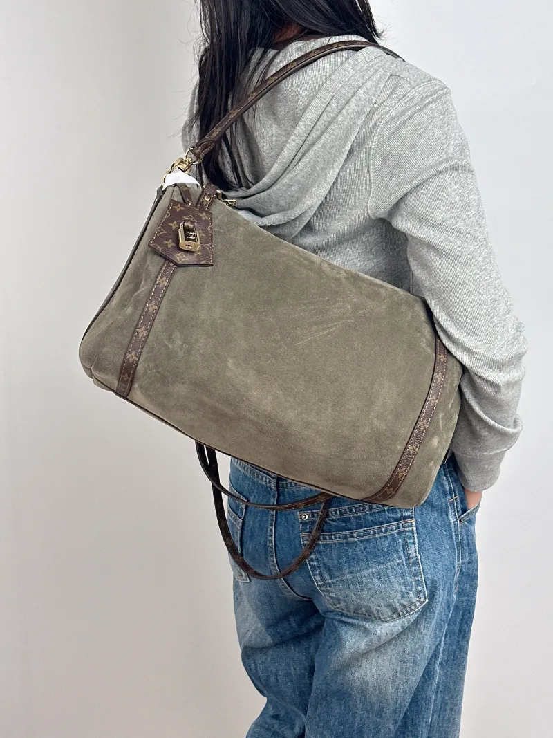Louis Vuitton Shoulder Bag EXPRESS Shoulder Bag Green Suede Medium 36 × 18.5 × 24 cm — on-model view 2 of 2