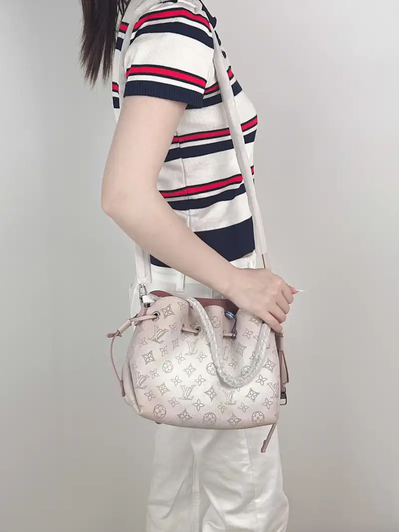 Louis Vuitton Crossbody Bag BELLA Calfskin One Size 22 × 14 × 19 cm — on-model view 1 of 3