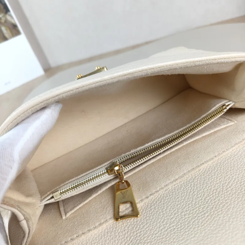 Louis Vuitton Crossbody Bag MADELEINE Beige Monogram Empreinte Embossed Calfskin BB 24 × 8.5 × 17 cm — detail view 7 of 12