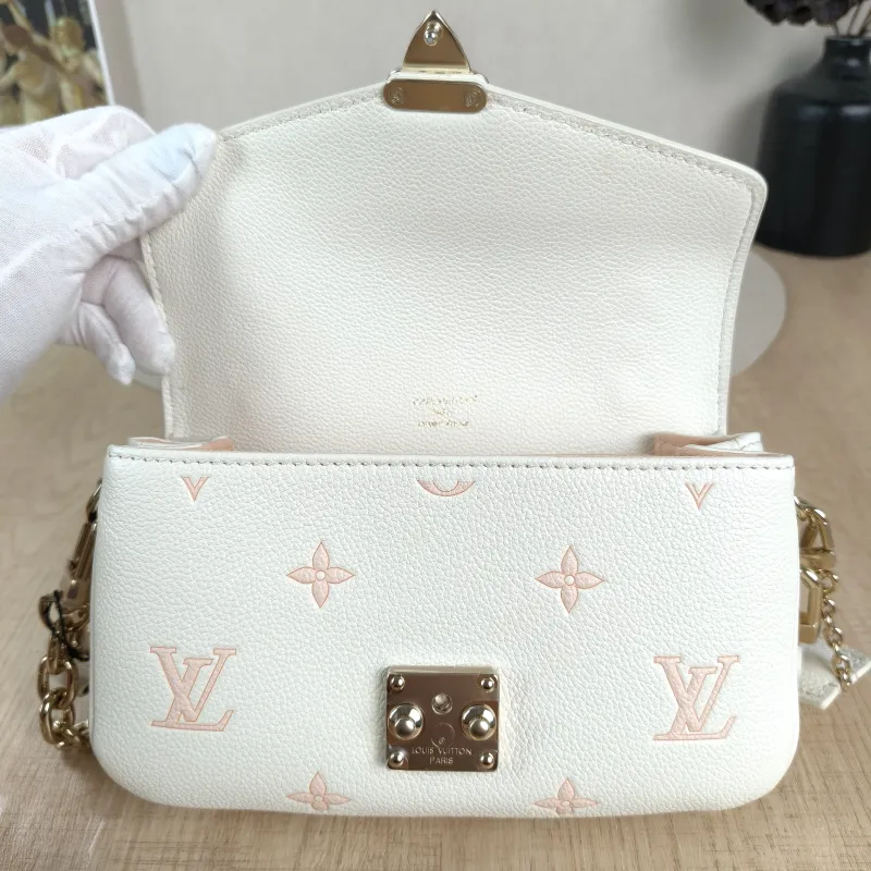 Louis Vuitton Crossbody Bag Pochette Métis East West White · Pink Monogram Empreinte Embossed Calfskin Small21.5 × 6 × 13.5 cm — detail view 1 of 13
