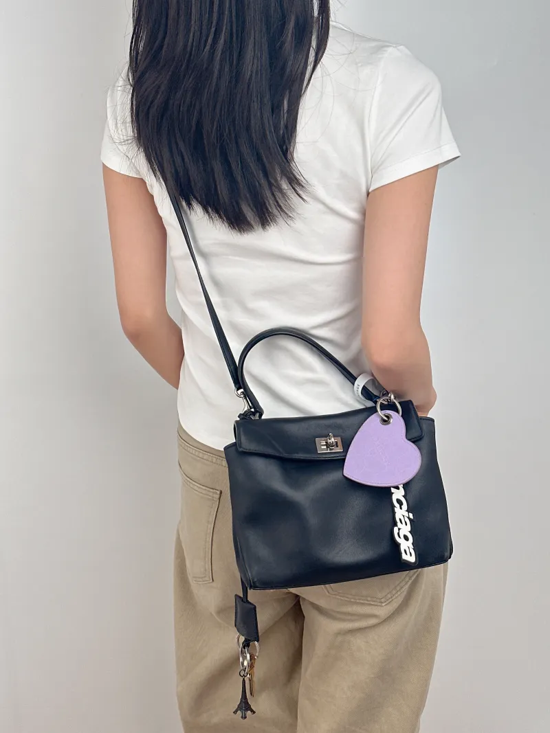 BALENCIAGA Crossbody Bag RODEO Black Calfskin Mini 23 × 10 × 17 cm — on-model view 3 of 3