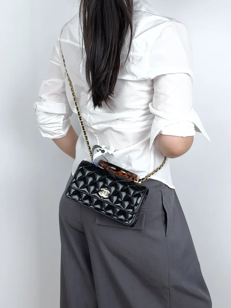 Chanel Crossbody Bag woc Black Waxed Leather One Size19 × 7 × 11 cm — on-model view 2 of 3