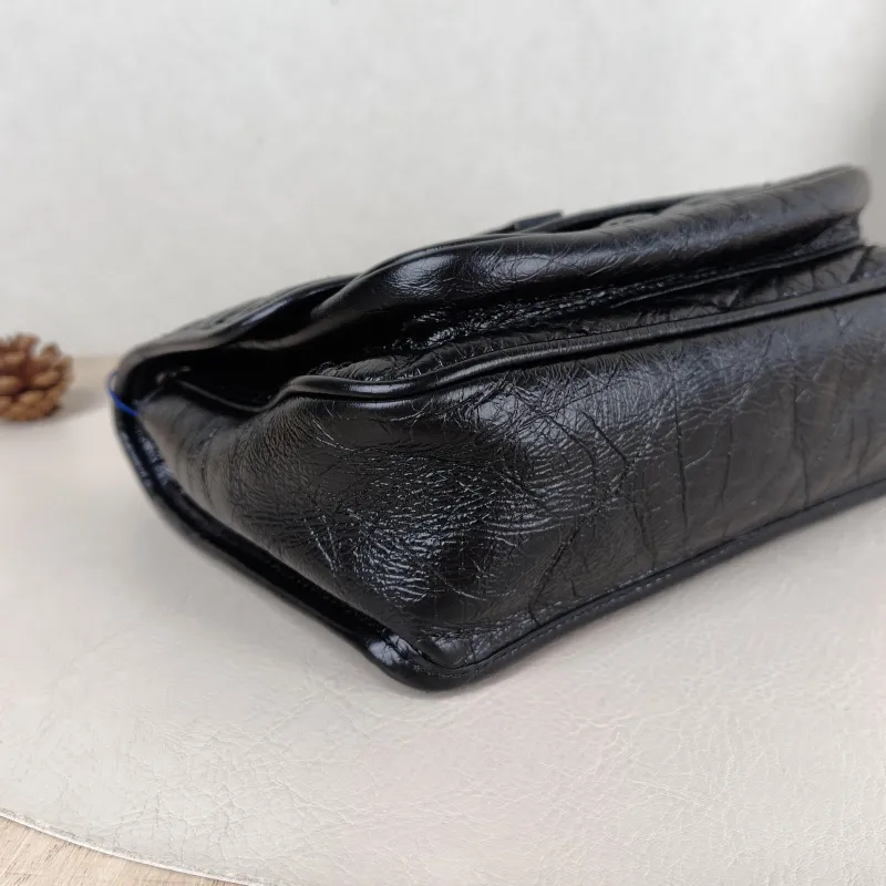 SAINT LAURENT Crossbody Bag Niki Black Waxed Leather Calfskin Small 21 × 7.5 × 16 cm — detail view 1 of 12