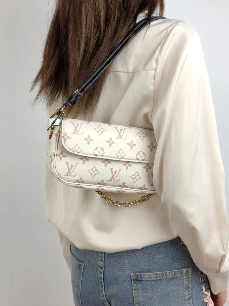 Louis Vuitton Crossbody Bag IVY · Beige PVC Small 23.5 × 4.3 × 12 cm — on-model view 2 of 3
