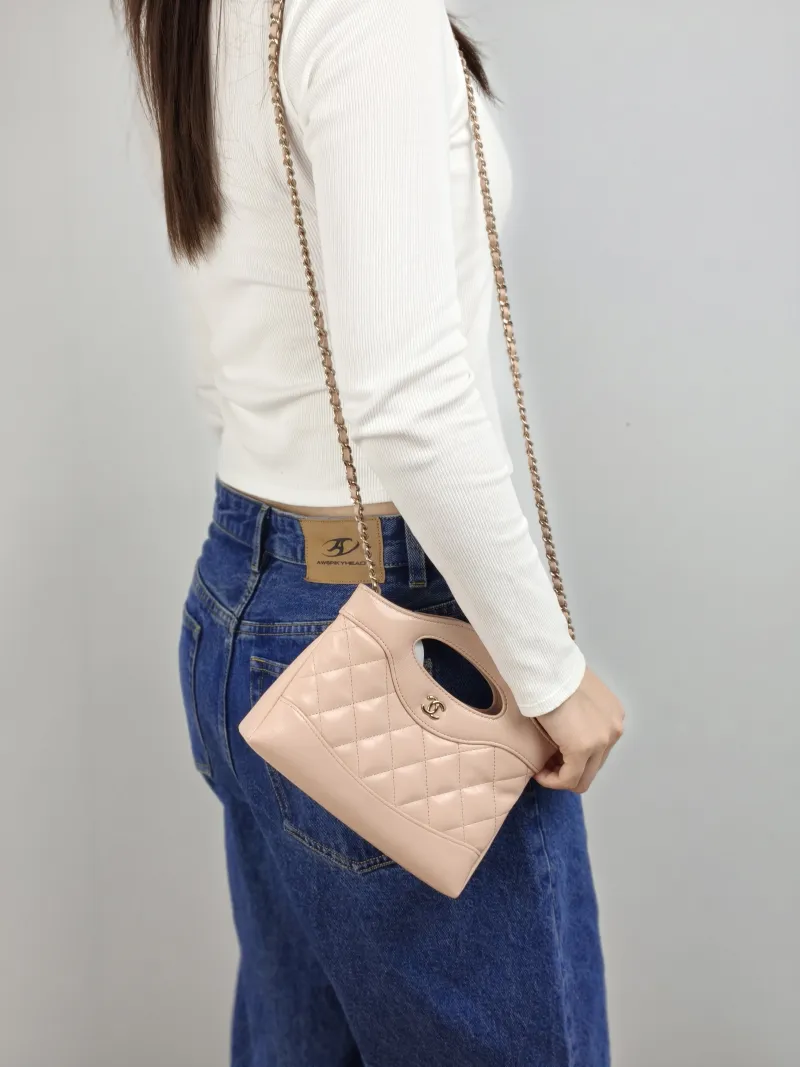 Chanel Crossbody Bag 31Bag Pink nano 20.5 × 3.5 × 17 cm — on-model view 2 of 3