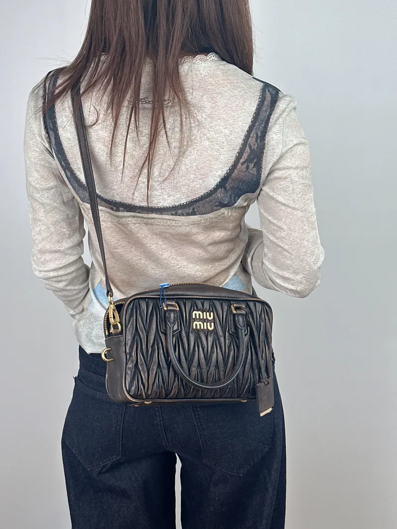 Miumiu Top Handle Bag Arcadie MatelasséCollection Edition Lambskin 25 × 8 × 15.5 cm — on-model view 1 of 2