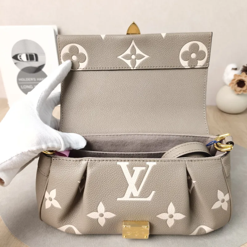 Louis Vuitton Crossbody Bag Favorite Empreinte Embossed Calfskin Medium24 × 9 × 14 cm — detail view 11 of 13