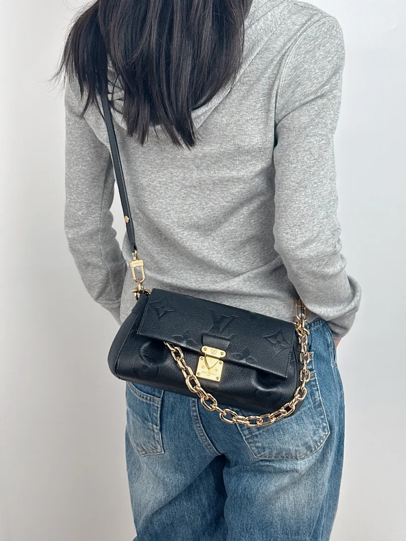 Louis Vuitton Crossbody Bag Favorite Black Monogram Empreinte Embossed Calfskin Medium 24 × 9 × 14 cm — on-model view 3 of 3